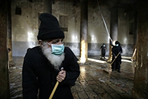 <b class=qtipBold><figcaption>GM1E5CT1TVM01</figcaption></b><br>A Greek Orthodox priest (L) sweeps inside the Church of Nativity, the site revered as the birthplace of Jesus, ahead of Orthodox Christmas in the West Bank town of Bethlehem December 29, 2009. REUTERS/Ammar Awad (WEST BANK - Tags: RELIGION SOCIETY IMAGES OF THE DAY) GM1E5CT1TVM01