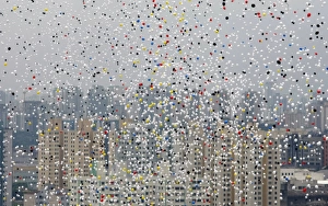 Prints of Balloons fly across the sky of Sao Paulo during year-end celebrations December 30, 2009. REUTERS/Paulo Whitaker (BRAZIL - Tags: SOCIETY ANNIVERSARY) Brazil Prints: GM1E5CV00QO01