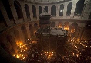 <b class=qtipBold><figcaption>GM1E6431RTO01</figcaption></b><br>Worshippers hold candles as they take part in the Christian Orthodox Holy Fire ceremony at the Church of the Holy Sepulchre in Jerusalem's Old city April 3, 2010. REUTERS/Ammar Awad (JERUSALEM - Tags: RELIGION IMAGES OF THE DAY) GM1E6431RTO01
