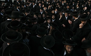 <b class=qtipBold><figcaption>GM1E74I05V301</figcaption></b><br>Ultra-Orthodox Jewish men take part in the ritual of "Mayim Shelanu", near a spring from which water is collected, near the West Bank Jewish settlement of Beit Horon April 17, 2011. The water is used to prepare matza, the traditional unleavened bread eaten during the upcoming Jewish holiday of Passover. Passover commemorates the flight of Jews from ancient Egypt as described in Exodus. REUTERS/Baz Ratner (WEST BANK - Tags: RELIGION) GM1E74I05V301