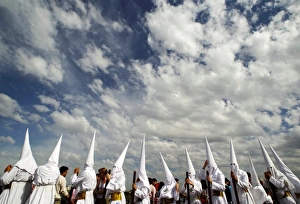 <b class=qtipBold><figcaption>GM1E74J043J01</figcaption></b><br>Penitents take part in the procession of "San Gonzalo" brotherhood during Holy Week in the Andalusian capital of Seville, southern Spain April 18, 2011. Hundreds of processions take place around the clock in Spain during Holy Week, drawing thousands of visitors. REUTERS/Marcelo del Pozo (SPAIN - Tags: SOCIETY RELIGION) GM1E74J043J01