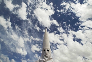 <b class=qtipBold><figcaption>GM1E74J04OT01</figcaption></b><br>A penitent takes part in the procession of "San Gonzalo" brotherhood during Holy Week in the Andalusian capital of Seville, southern Spain, April 18, 2011. Hundreds of processions take place around the clock in Spain during Holy Week, drawing thousands of visitors. REUTERS/Marcelo del Pozo (SPAIN - Tags: SOCIETY RELIGION IMAGES OF THE DAY) GM1E74J04OT01