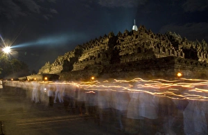 <b class=qtipBold><figcaption>GM1E75I079F01</figcaption></b><br>Indonesian Buddhists walk in the Borobudur temple during a ceremony on Vesak Day in Magelang in Indonesia's Central Java May 17, 2011. Buddhists in Indonesia celebrated Vesak Day on Tuesday to honour the birth, enlightenment and death of Buddha. Picture taken using long exposure. REUTERS/Dwi Oblo (INDONESIA - Tags: RELIGION SOCIETY) GM1E75I079F01