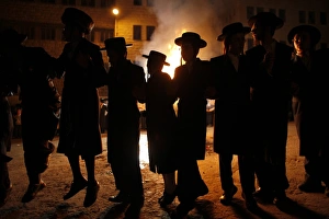 <b class=qtipBold><figcaption>GM1E75M0JHI01</figcaption></b><br>Ultra Orthodox Jews dance next to a bonfire during Lag Ba-Omer festivities in Jerusalem's Mea Shearim neighbourhood May 21, 2011. Israelis celebrate the Jewish holiday of Lag Ba-Omer, which marks the end of a plague in the Middle Ages that killed thousands of disciples of a revered rabbi in the holy land, by lighting bonfires across the country. REUTERS/Nir Elias (JERUSALEM - Tags: RELIGION IMAGES OF THE DAY) GM1E75M0JHI01