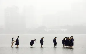 Prints of Students in graduation robes stand on a stone bridge submerged underwater at the flooded Donghu Lake in Wuhan, Hubei province, June 21, 2011 China Prints: GM1E76L13R201