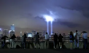 <b class=qtipBold><figcaption>GM1E79C0Y4Z01</figcaption></b><br>A group of people photograph the Tribute in Lights as it illuminate the sky over New York's Lower Manhattan skyline during events marking the 10th anniversary of the 9/11 attacks on the World Trade Center from Jersey City, New Jersey, September 11, 2011. REUTERS/Gary Hershorn (UNITED STATES - Tags: ANNIVERSARY DISASTER CITYSCAPE) GM1E79C0Y4Z01