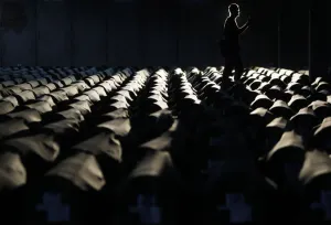 <b class=qtipBold><figcaption>GM1E97A0A2V01</figcaption></b><br>A Bosnian man walks near the 409 coffins of newly identified victims of the 1995 Srebrenica massacre in Potocari Memorial Center, near Srebrenica July 9, 2013. The bodies of the recently identified victims will be buried on July 11 marking the 18th anniversary of the massacre in which Bosnian Serb forces commanded by Ratko Mladic killed up to 8, 000 Muslim men and boys and buried them in mass graves. REUTERS/Dado Ruvic (BOSNIA AND HERZEGOVINA - Tags: SOCIETY CIVIL UNREST TPX IMAGES OF THE DAY) - RTX11I0J GM1E97A0A2V01