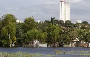 Goalposts stand in a soccer field flooded by the waters of the Paraguay River in Asuncion