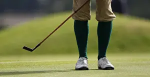 A golfer makes a practice swing with his hickory club during the World Hickory Golf
