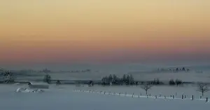 Weather Prints: Ground fog lies on a field during the first sunrise of 2015 on a field near Warngau