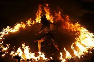 Hanuman, the Hindu monkey god, performs during a Kecak dance show at Uluwatu temple