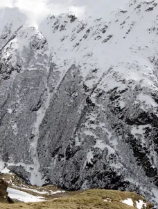 Switzerland Prints: A helicopter conducts a search over the site of an avalanche near Bourg-St-Pierre