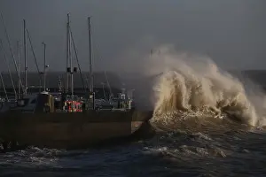 Weather Prints: A high wave crashes on the protecting wall at the fishing harbour in Pornic