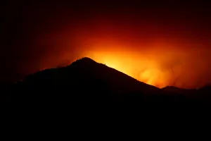 California Prints: A hill is being silhouetted by flames during the Nuns Fire in Kenwood, California