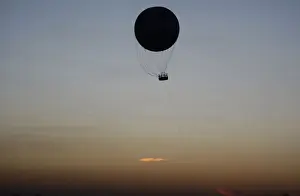 A hot air balloon the shape of a soccer ball flies in Soweto ahead of the Confederations