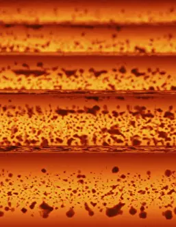 Hot steel bars are processed at a factory belonging to Ezz Steel at an industrial