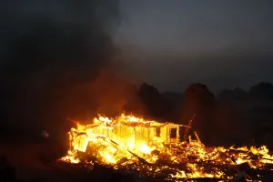 Wildfire Prints: A house burns in the Twin Pines Road area at the Silver Fire near Banning