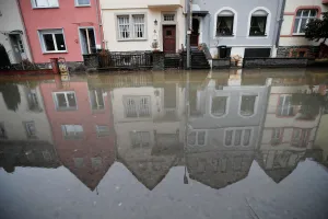 Weather Prints: Houses are reflected in the waters of the river Moselle after the river flooded