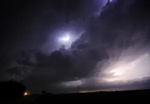 Prints of A huge tornadic supercell lights up the night skies over Salina, Kansas, during the third day of severe weather and multiple tornado sightings, April 14, 2012 USA Prints: A huge tornadic supercell lights up the night skies over Salina
