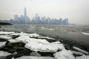 Weather Prints: Ice lines the shoreline of the Hudson River as the New York City skyline is seen