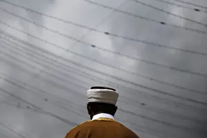 Religion Prints: An imam leads Eid al-Fitr services as Muslim worshippers pray in the Queens borough of