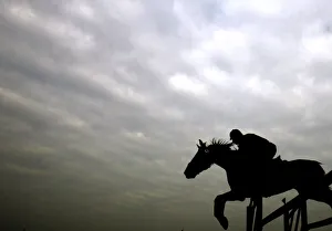 India Prints: An Indian horse rider jumps an obstacle during a horse show in Kolkata