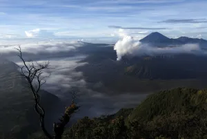 Indonesia Prints: Indonesias Mount Bromo volcano spew smoke next to Mount Semeru volcano as seen