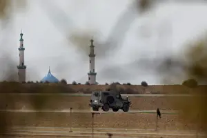 Prints of An Israeli military jeep drives near the area where the Israeli forces said a significant cross-border attack tunnel from the Gaza Strip, which was being dug by the enclaves dominant Islamist group Israel Prints: An Israeli military jeep drives near the area where the Israeli forces said a
