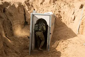 Prints of An Israeli soldier enters what the Israeli military say is a cross-border attack tunnel dug from Gaza to Israel, on the Israeli side of the Gaza Strip border near Kissufim January 18, 2018 Israel Prints: An Israeli soldier enters what the Israeli military say is a cross-border attack tunnel