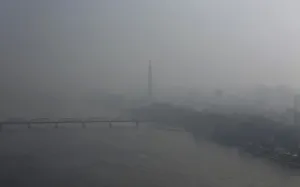 Korea Prints: Juche Tower stands beside the Taedong River, amid morning fog in Pyongyang