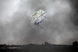 Prints of A kite flies over the border in an area where kites and balloons have caused blazes, between Israel and the Gaza strip June 8, 2018. REUTERS/Amir Cohen Israel Prints: A kite flies over the border in an area where kites and balloons have caused blazes