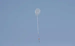 Prints of A kite loaded with a flammable material is flown by Palestinian demonstrators to be thrown at the Israeli side during a protest marking al-Quds Day, (Jerusalem Day), at the Israel-Gaza border Israel Prints: Kite loaded with a flammable material is flown by Palestinian demonstrators to be thrown