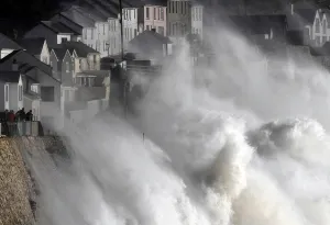 Storm Prints: Large waves crash along sea defences and the harbour as storm Ophelia approaches