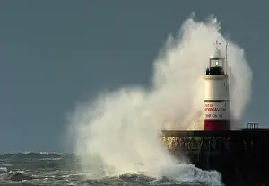 Trending: Large waves of the English Channel hit the light beacon and seawall at Newhaven in