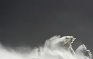 Images Dated 2014 February: Large waves hit the lighthouse and harbour at high tide at Newhaven in Sussex