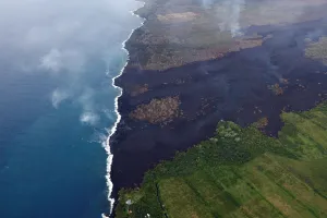 Hawaii Prints: The lava flow cuts across Highway 137 entering the ocean near Kapoho, Hawaii