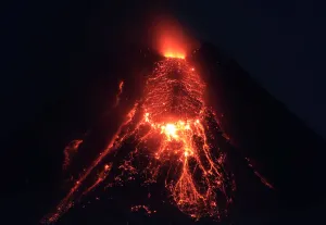 Philippines Prints: Lava flows from the crater of Mount Mayon Volcano during an eruption in Legazpi city