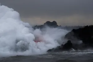 Hawaii Prints: Lava glows through the laze as it pours into the ocean during the eruption of the Kilauea