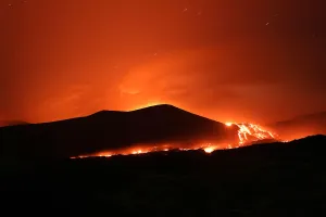 Italy Prints: Lava and plumes of smoke erupt from Mount Etna
