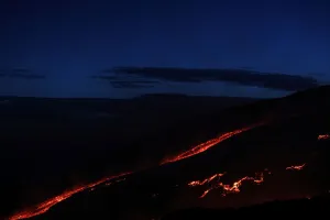 Italy Prints: Lava and plumes of smoke erupt from Mount Etna