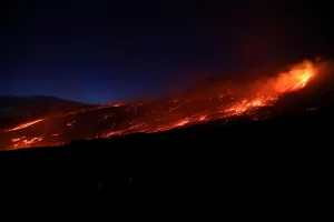 Italy Prints: Lava and plumes of smoke erupt from Mount Etna