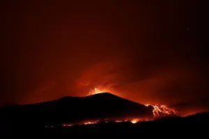 Italy Prints: Lava and plumes of smoke erupt from Mount Etna