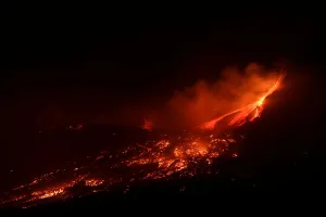Italy Prints: Lava and plumes of smoke erupt from Mount Etna