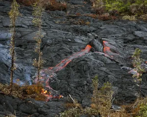 Lava Prints: Lava spouts from a hot spot as the lava flow from Mt. Kilauea inches closer to