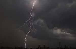 General Prints: Lightning is seen above buildings during a storm in central Shanghai