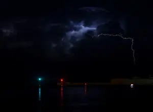 A lightning storm is seen beyond the entrance to Vallettas Grand Harbour