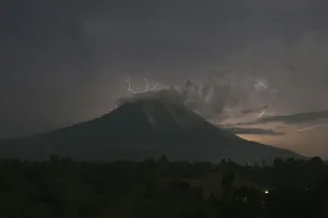 Indonesia Prints: Lightning strikes as Mount Sinabung volcano spews ash and hot lava