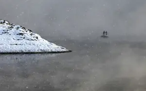 Prints of Two local residents row on a boat through a frosty fog as they cross the Shumikha Bay of the Yenisei River, with the air temperature at about minus 23 degrees Celsius (minus 9.4 degrees Fahrenheit) Russia Prints: Two local residents row on a boat through a frosty fog as they cross the Shumikha
