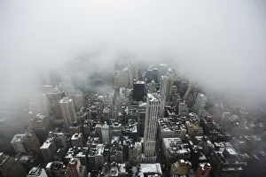 Prints of Low lying clouds from a snowstorm obscure the skyline of New York December 10, 2013. REUTERS/Lucas Jackson (UNITED STATES - Tags: ENVIRONMENT CITYSCAPE TPX IMAGES OF THE DAY) USA Prints: Low lying clouds from a snowstorm obscure the skyline of New York