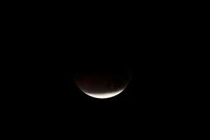 Lunar Prints: A lunar eclipse is shown over the ocean in Oceanside, California
